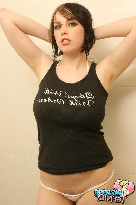 16P Pictures of a naughty brunette rubbing oil all over her big natural boobs