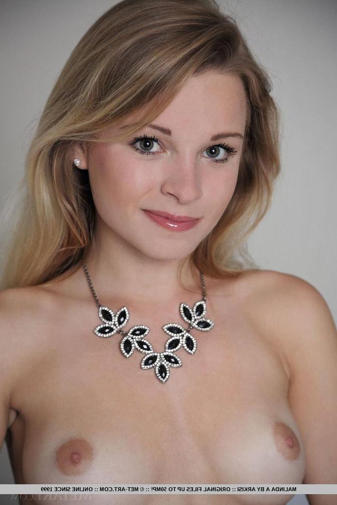 18P Beautiful blonde Malinda A spreads her legs in black stockings