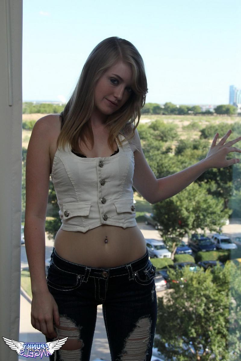 12P Mandy Roe gets topless in her tight ripped jeans before peeling them off in front of a big hotel window