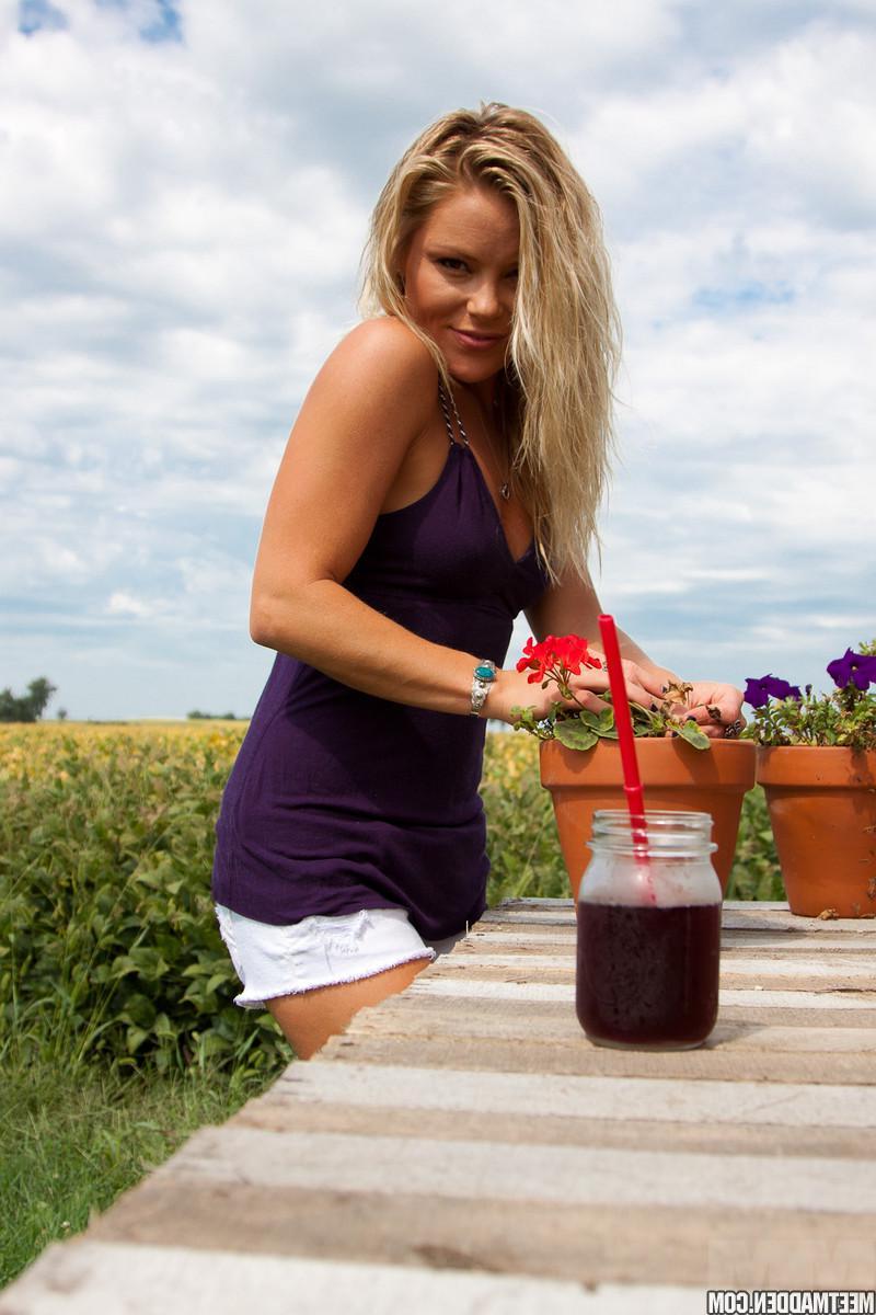 15P Blonde country girl Madden tends to her flowers outside