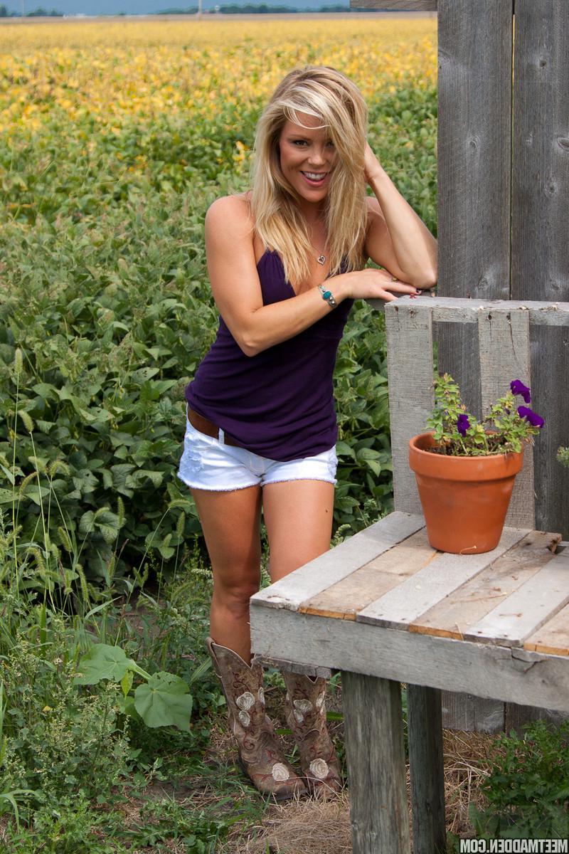 15P Blonde country girl Madden tends to her flowers outside