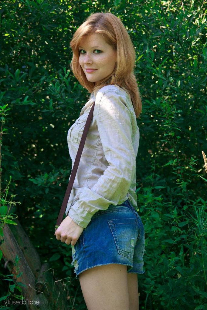 16P Pictures of redhead teen Mia Sollis showing you her tight pussy outside