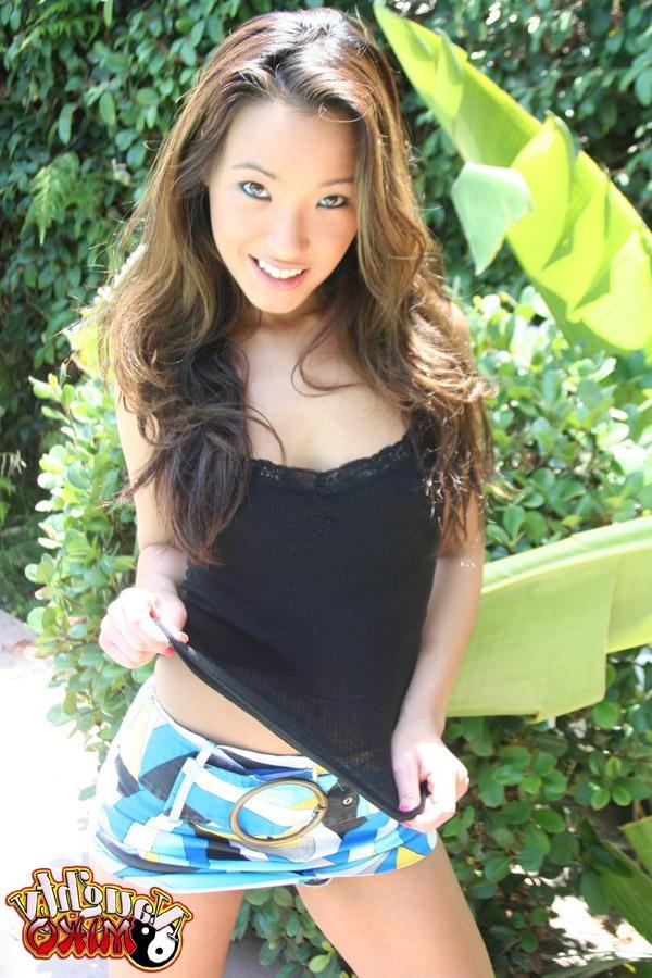12P Asian babe Miko teases and poses in a short skirt