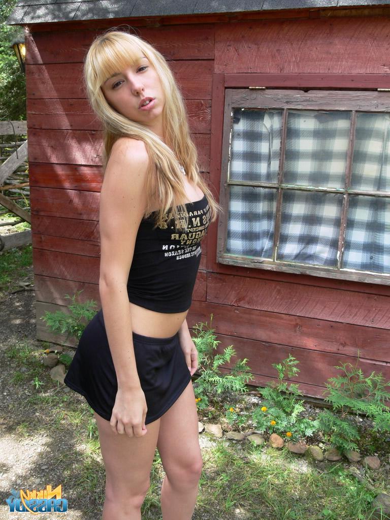 20P Pictures of teen babe Nikky Cassidy stripping in the back yard
