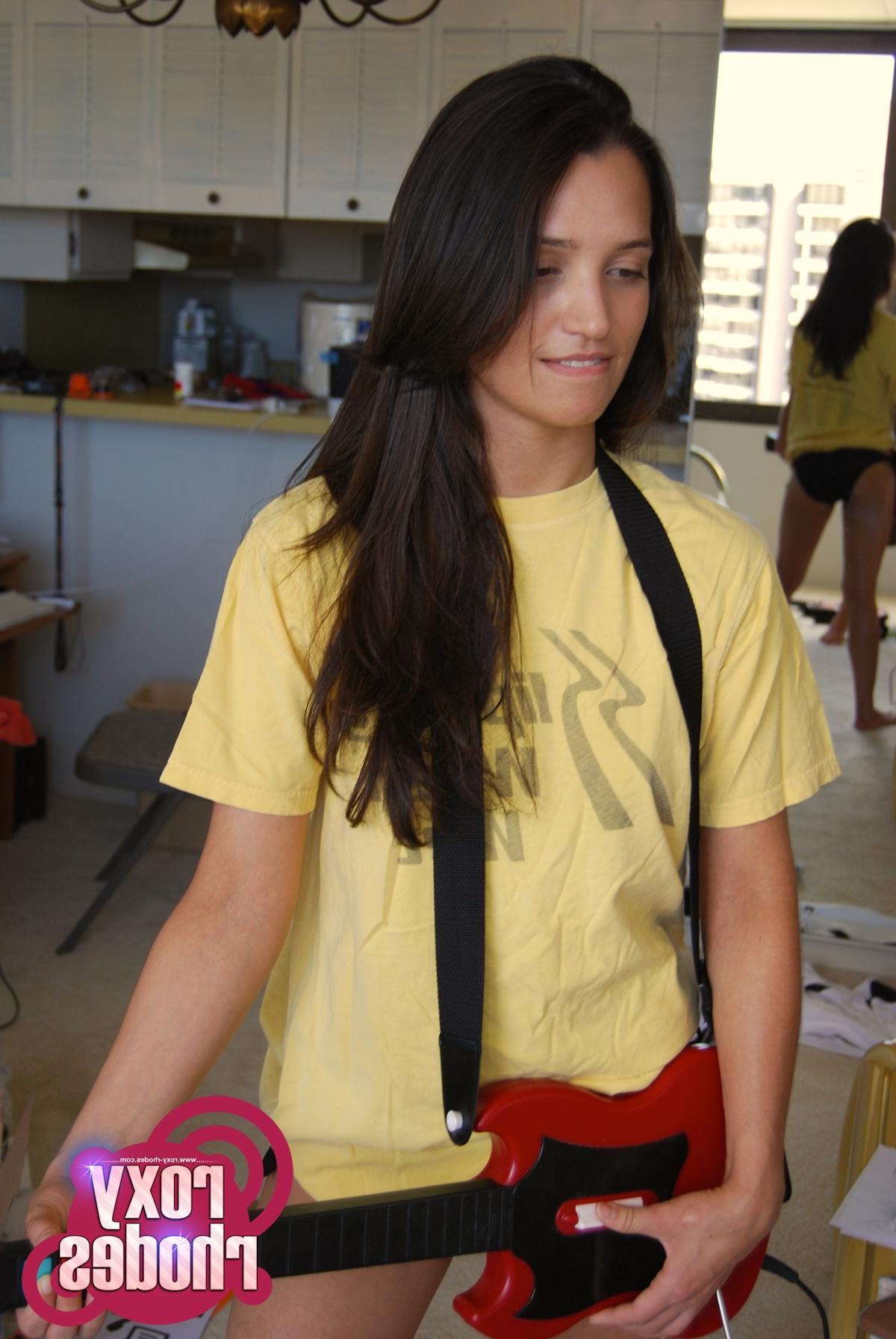 15P Pictures of teen girl Roxy Rhodes playing a sexy game of guitar hero