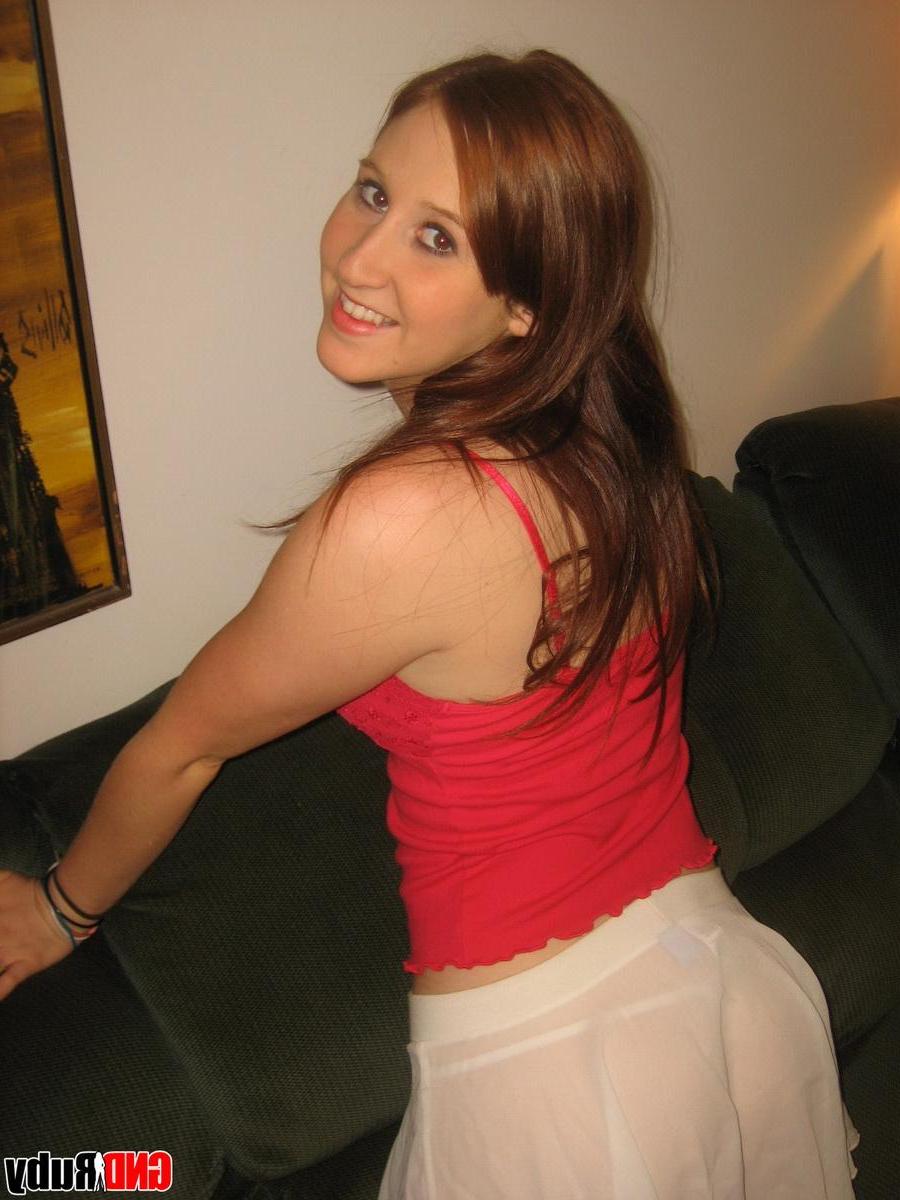 12P Horny redhead Ruby isnt shy as she strips naked and toys her pussy with a huge dildo
