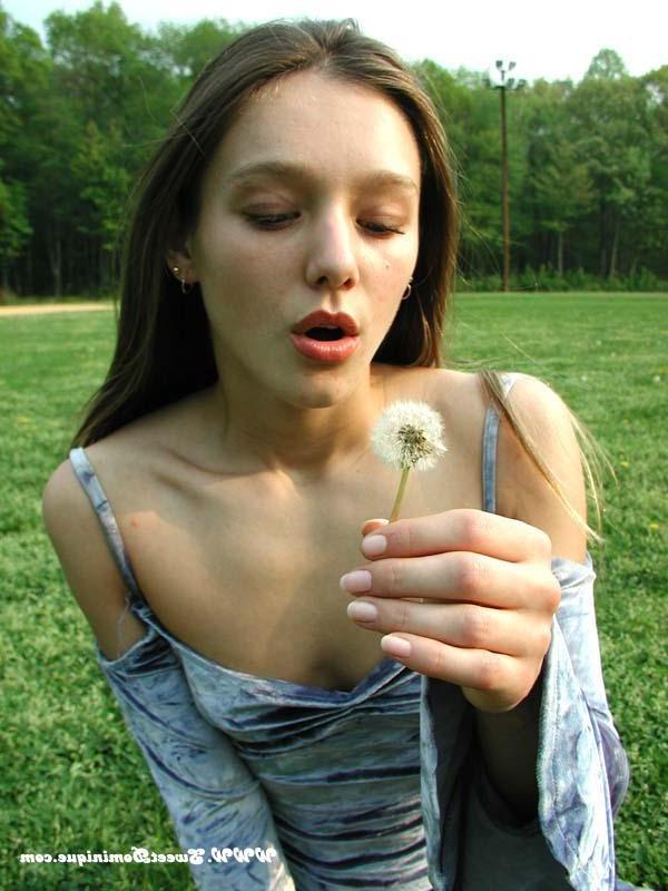 15P Pictures of Sweet Dominique teasing in a park