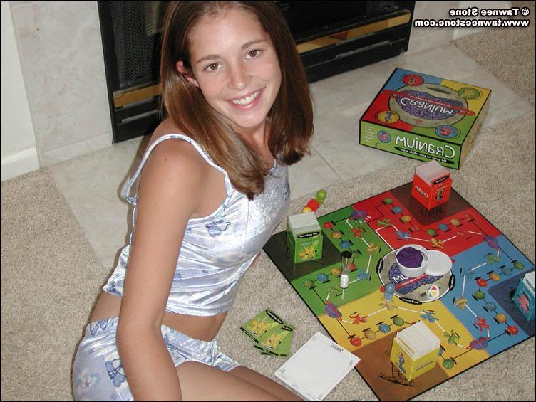 20P Pictures of Tawnee Stone playing a board game with herself