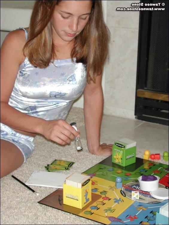 20P Pictures of Tawnee Stone playing a board game with herself