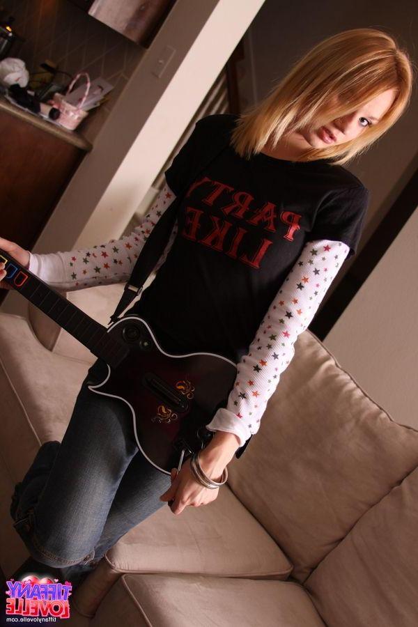 16P Pictures of teen amateur Tiffany Lovelle playing a hot game of guitar hero