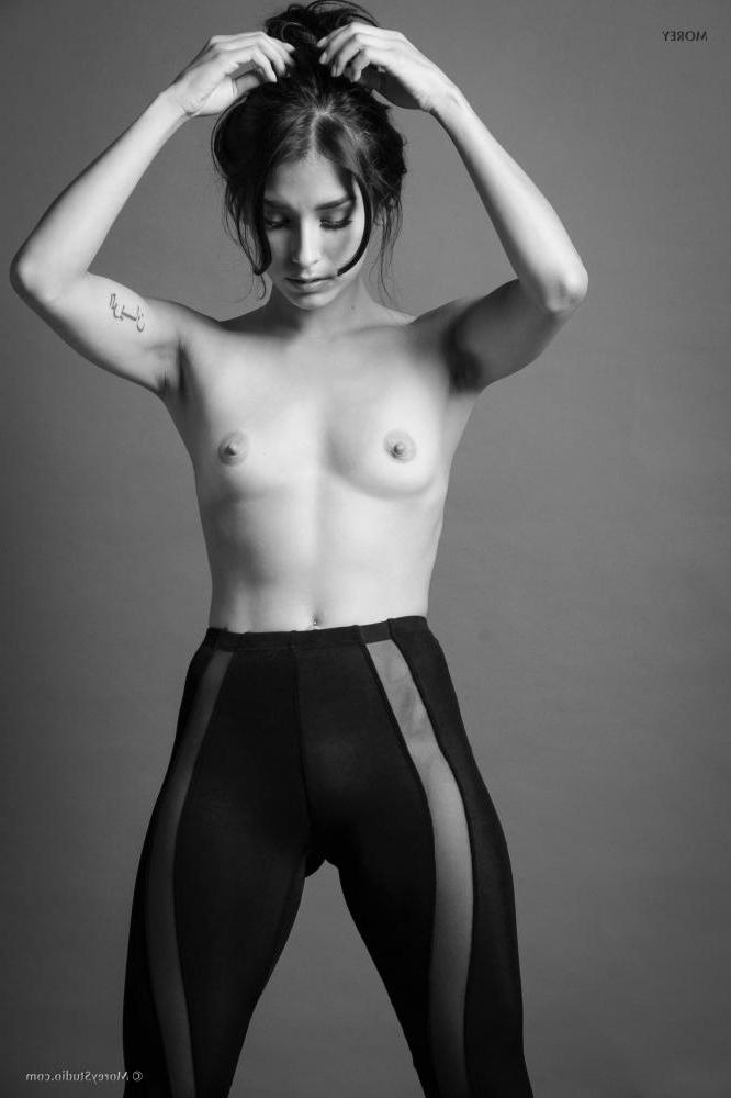 11P Brunette teen Marie shows off her petite tits in black and white