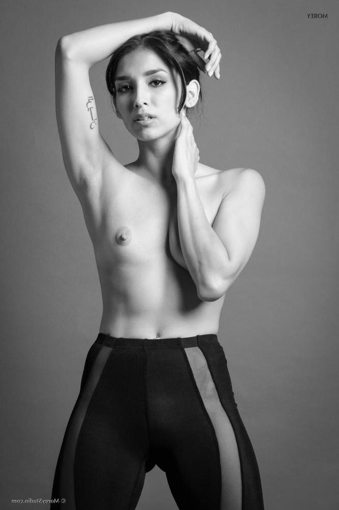 11P Brunette teen Marie shows off her petite tits in black and white