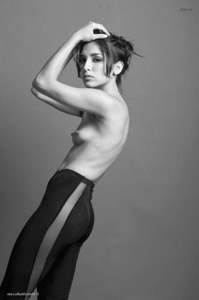 11P Brunette teen Marie shows off her petite tits in black and white