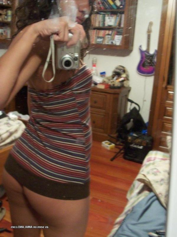 15P Photos of a kinky amateur chick showing her tits and pussy