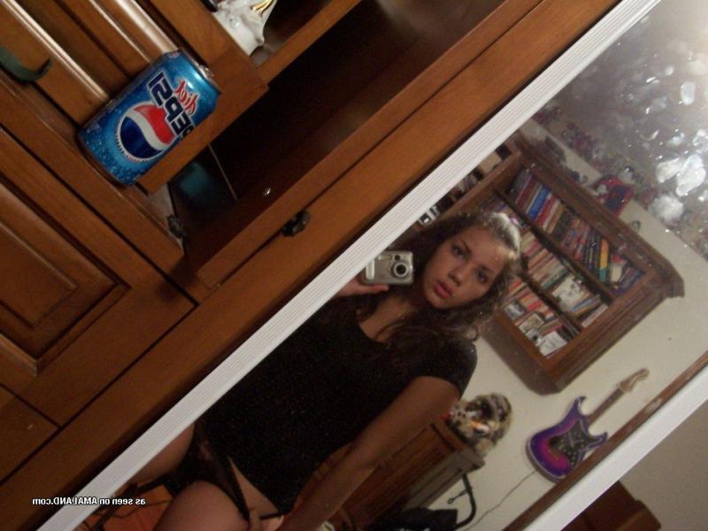 15P Photos of a kinky amateur chick showing her tits and pussy