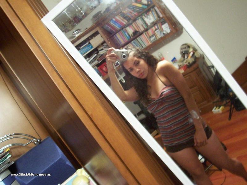 15P Photos of a kinky amateur chick showing her tits and pussy