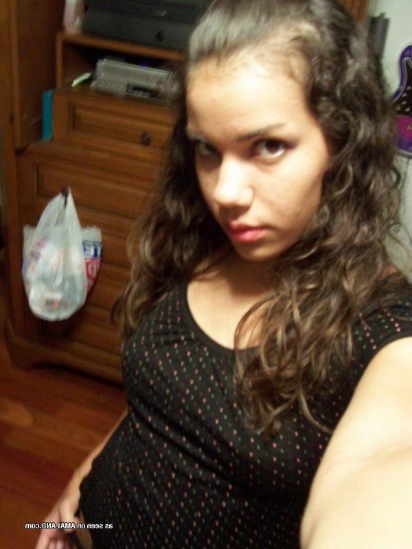 15P Photos of a kinky amateur chick showing her tits and pussy