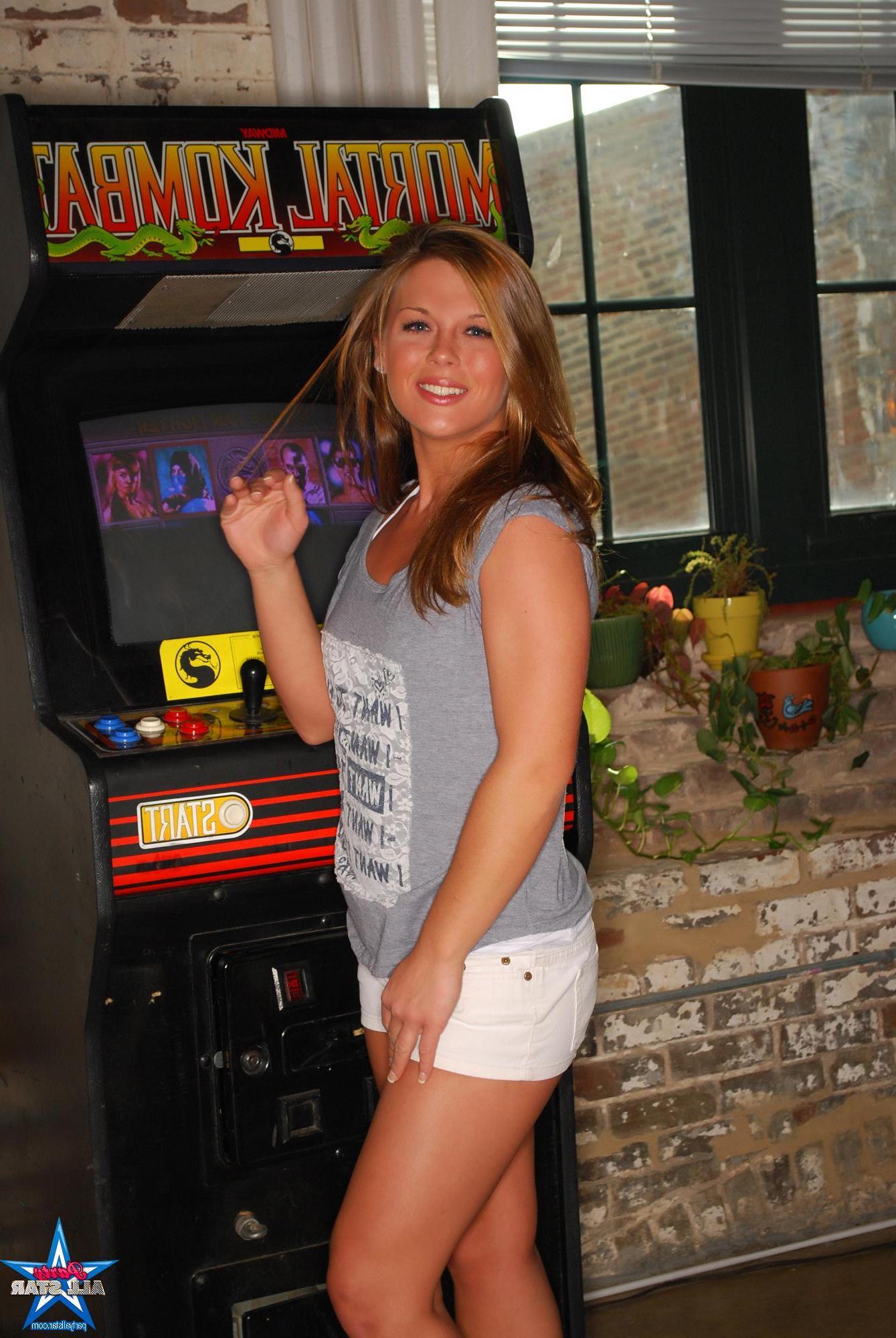 20P Pictures of sexy blonde teen Tiffany playing a kinky game of Mortal Kombat
