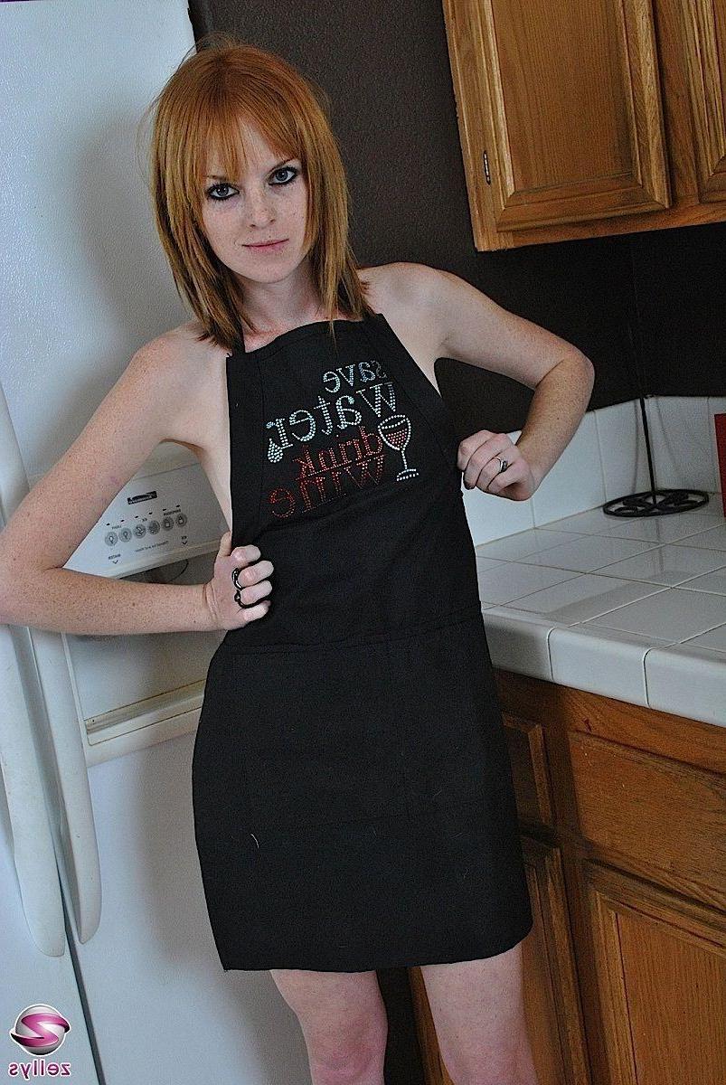 15P Pictures of a hot redhead teen naked in the kitchen
