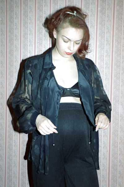 24P Pregnant brunette showing off her body and belly