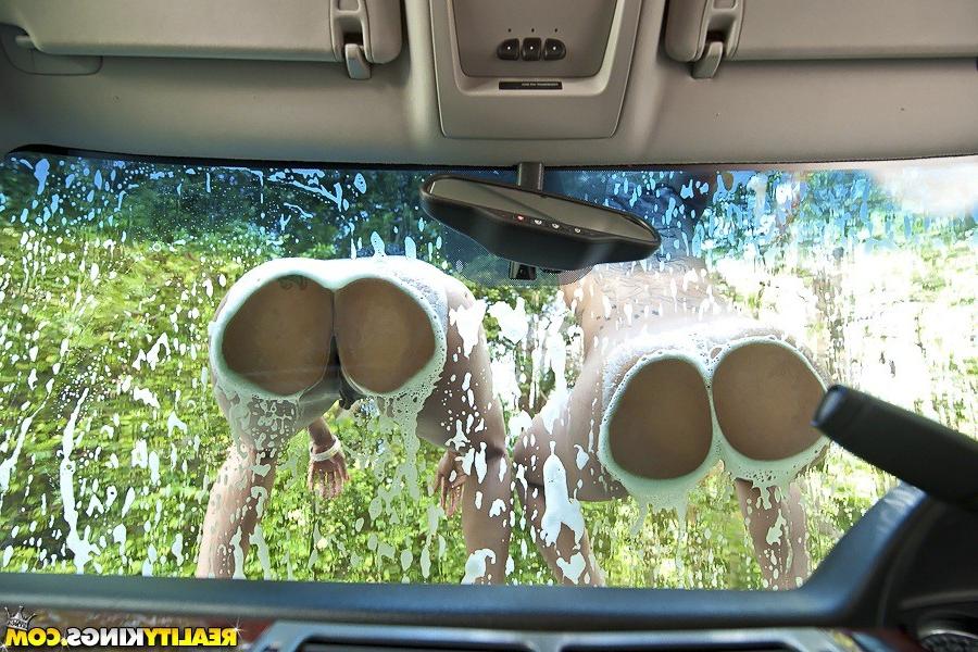 12P Two ebony girls fucks on nude car washing service