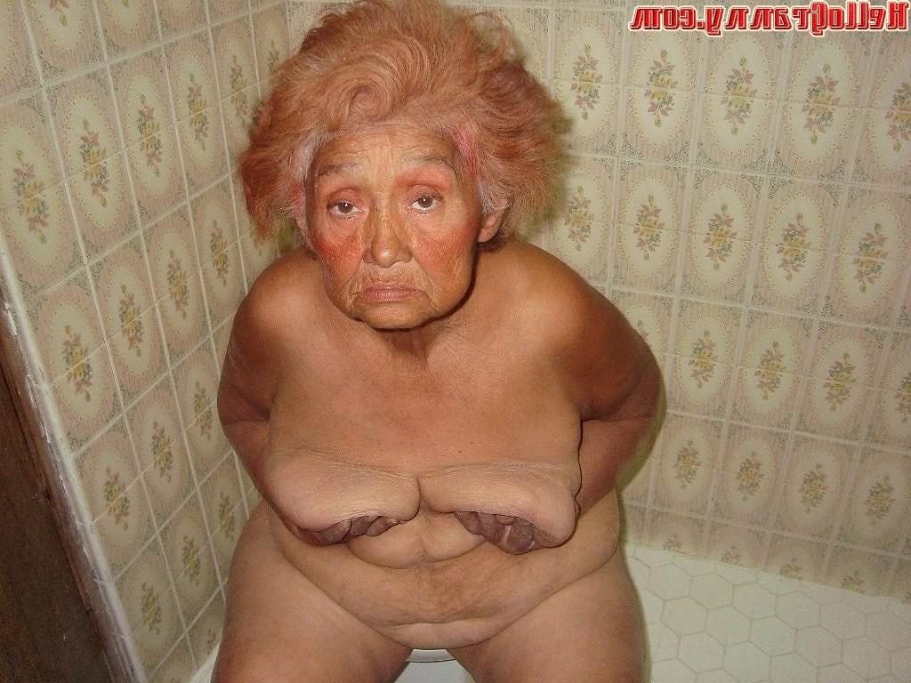 16P Painted granny in the shower plays with her boobs