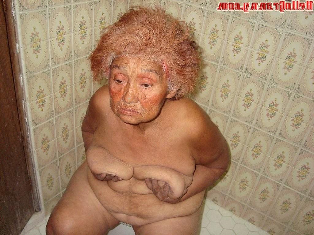 16P Painted granny in the shower plays with her boobs