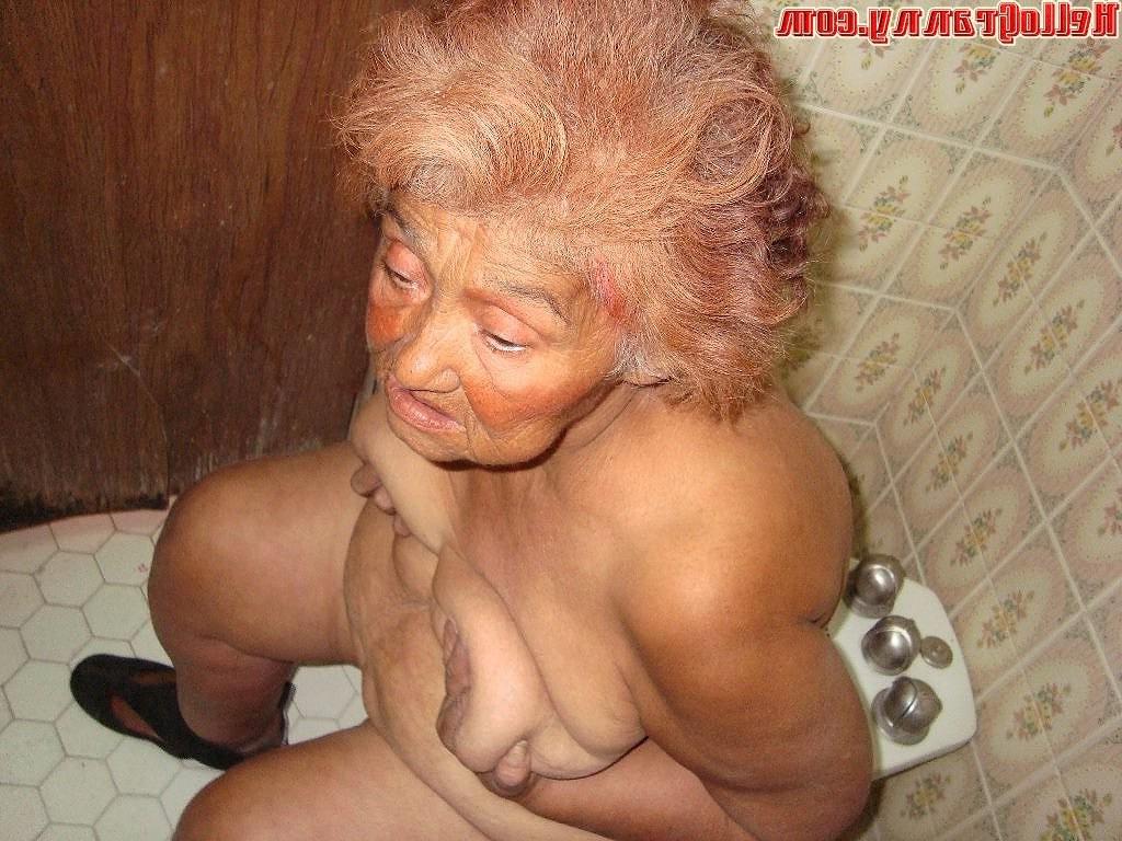 16P Painted granny in the shower plays with her boobs