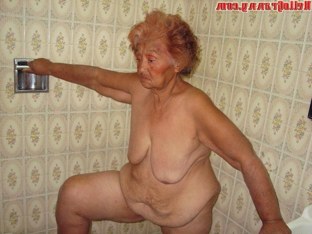 16P Painted granny in the shower plays with her boobs