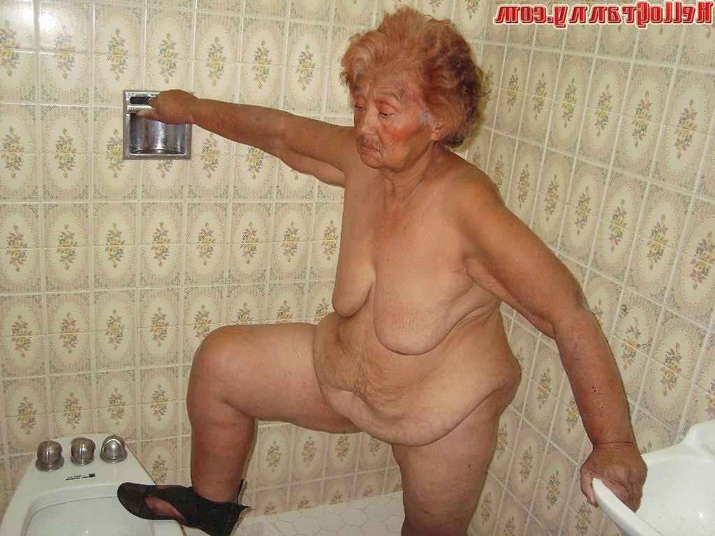16P Painted granny in the shower plays with her boobs