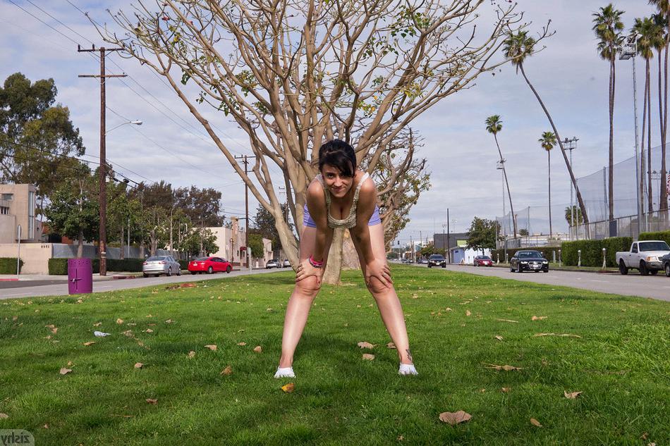 16P Silly girl in shorts outdoors