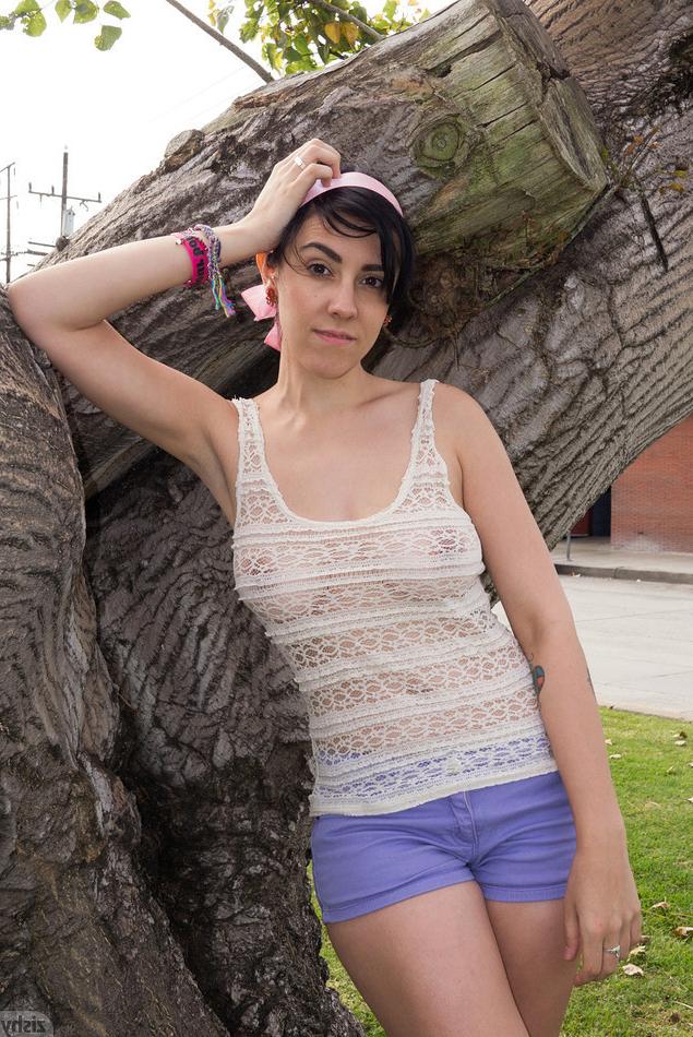 16P Silly girl in shorts outdoors