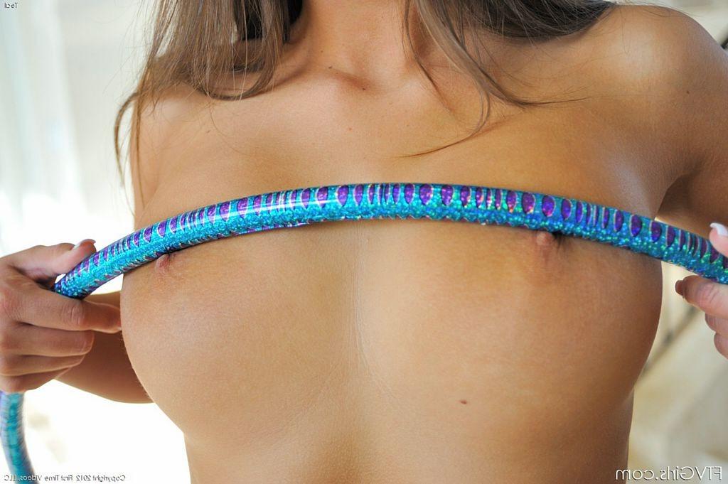 15P Athletic and fit girl uses her hula hoop while topless