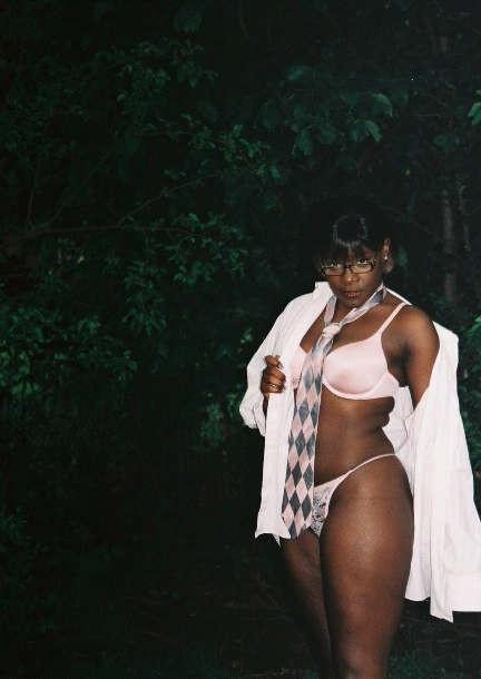 12P Black chick with short hair poses like a model