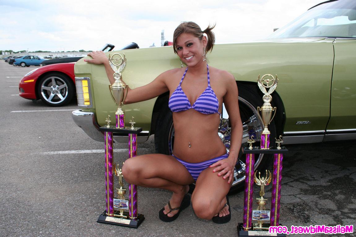 15P Melissa Midwest posing on cars at a car show