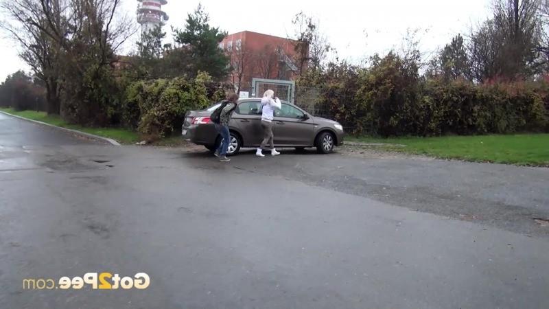 15P Two friends piss behind a parked car