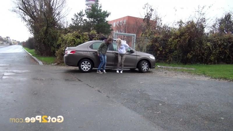 15P Two friends piss behind a parked car