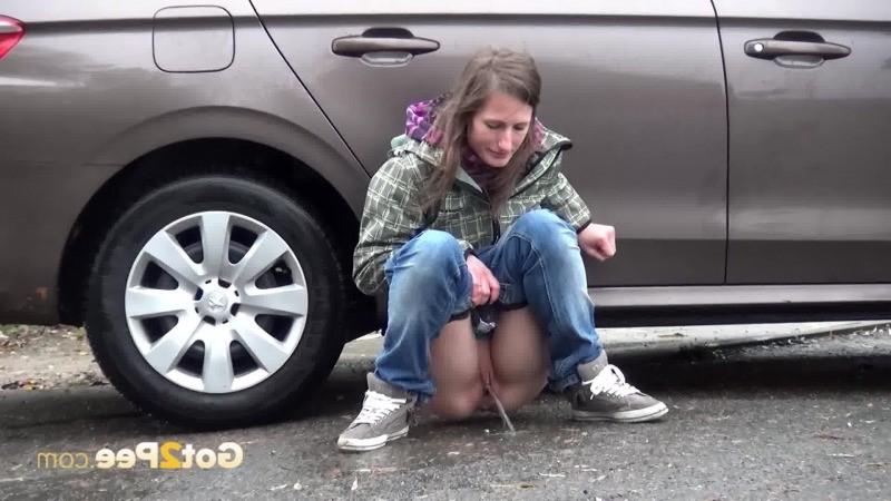 15P Two friends piss behind a parked car