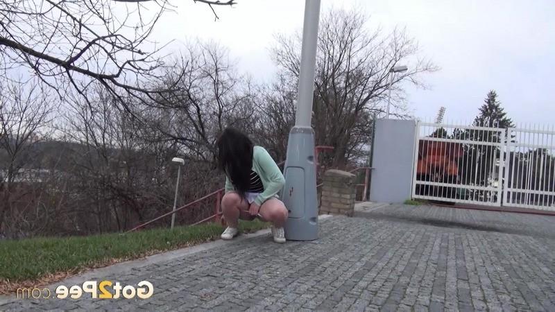 15P Dark haired girl is watched outside as she pees