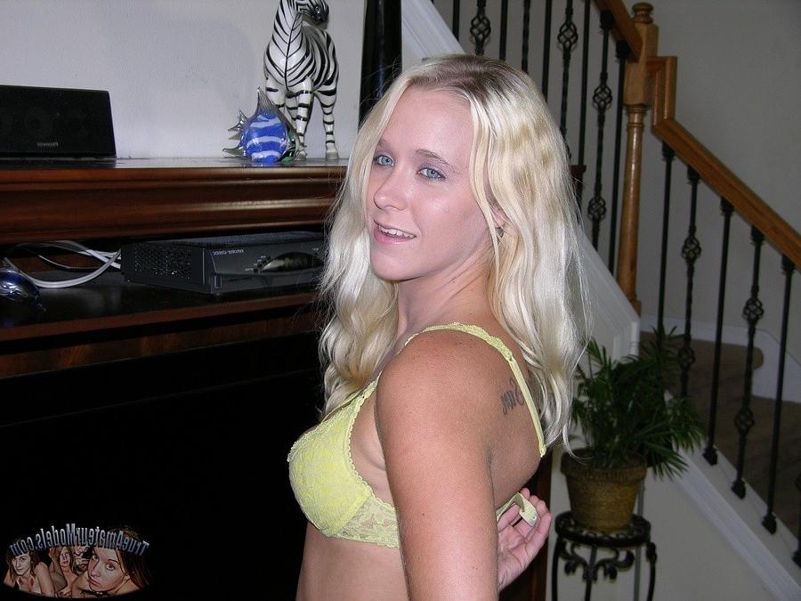 14P Blonde babe removes shorts and models nude