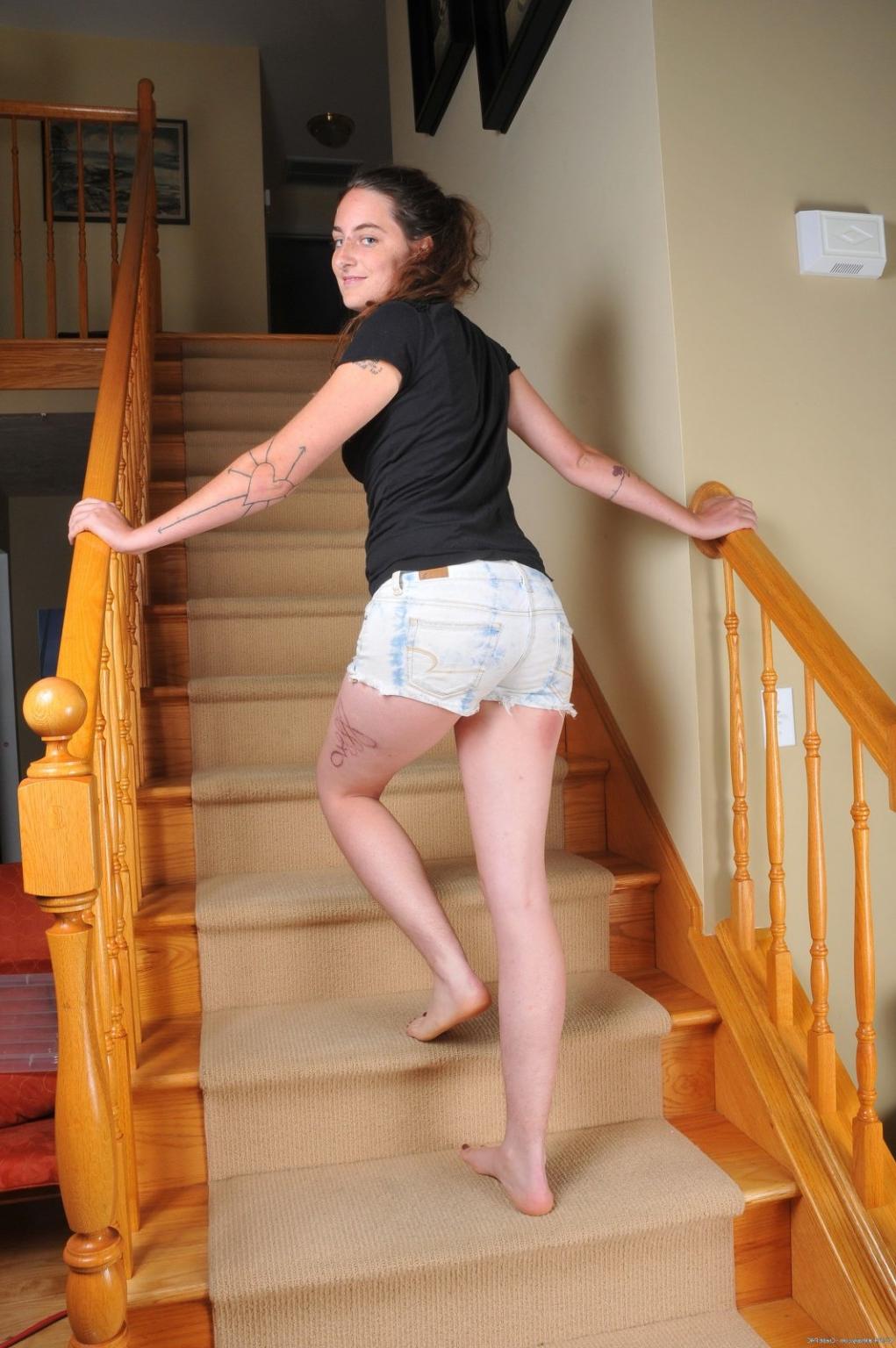 15P Isis strips and spreads her legs to expose her hairy crotch