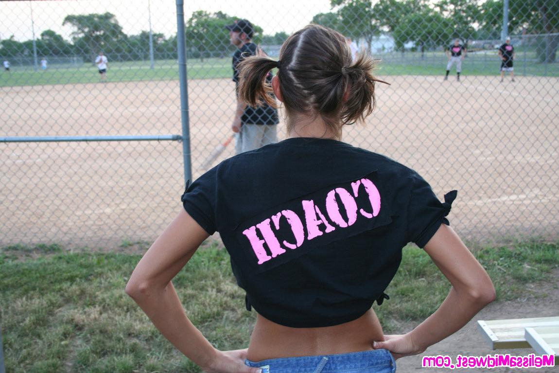 15P Melissa Midwest out at a softball game with her team shirt on