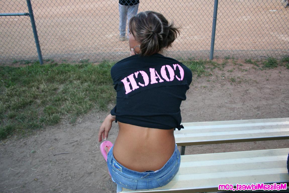 15P Melissa Midwest out at a softball game with her team shirt on