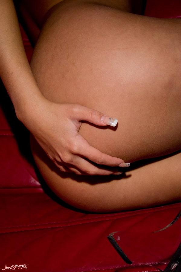 15P Hot latina poses nude on couch