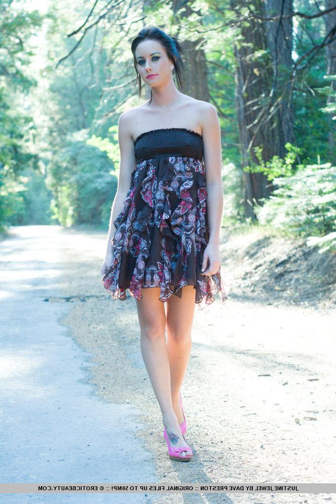 16P Justine Jewel playfully poses amidst the tall trees on a country