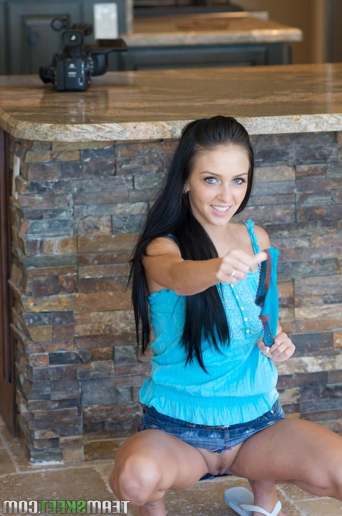 12P skinny brunette teen spreads her legs on the couch and touches 