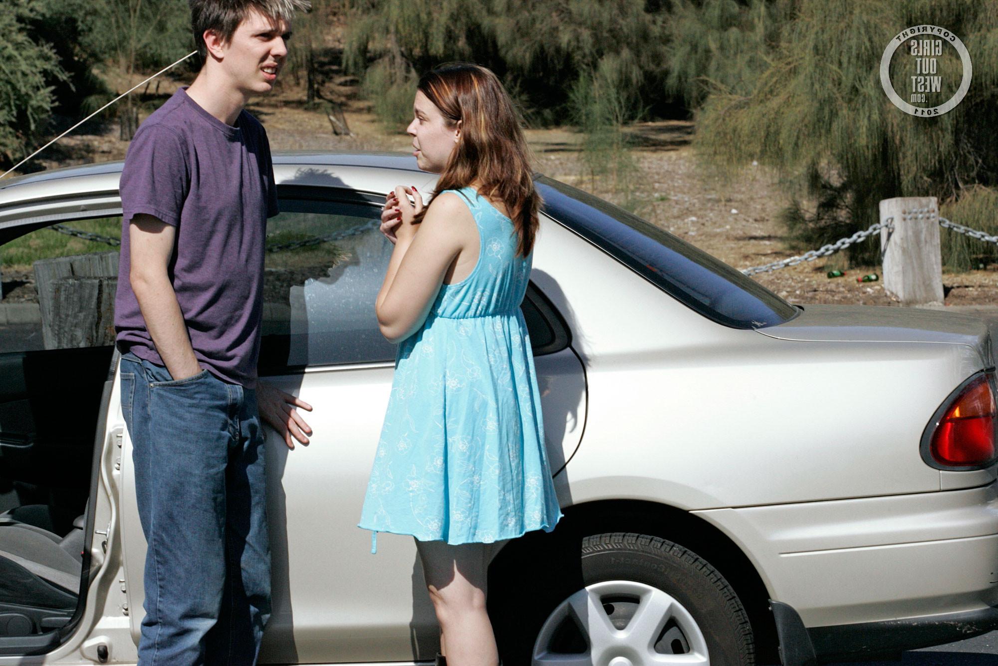 15P Real couple having fun in busy car park