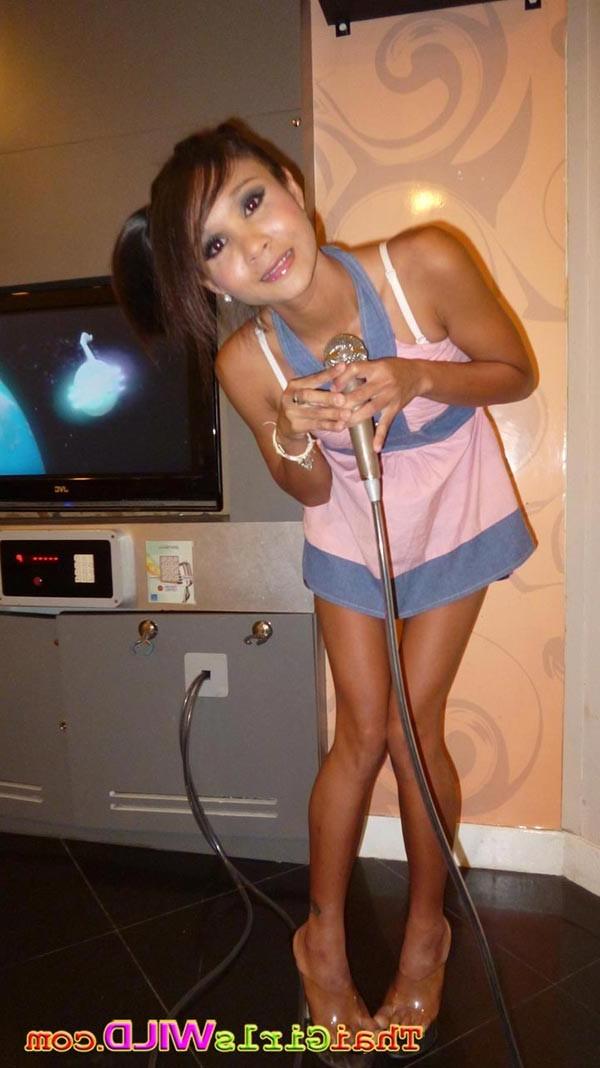 14P Skinny amateur Asian girl named Earn strips to show off her naked body
