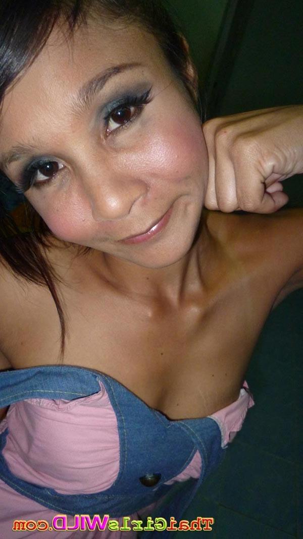 14P Skinny amateur Asian girl named Earn strips to show off her naked body