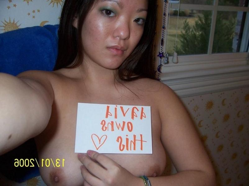 16P Asian does a stiptease befoe sliding her pussy on huge cock